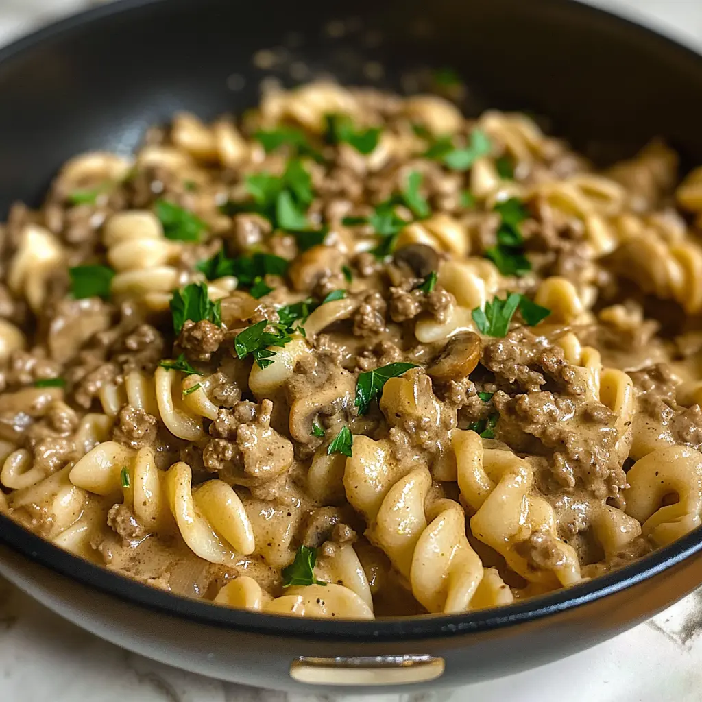 I love how this Hamburger Stroganoff warms my soul with its rich flavors! Ground beef, creamy sauce, and mushrooms make this dish a comforting classic. Save this easy recipe for a cozy family dinner!